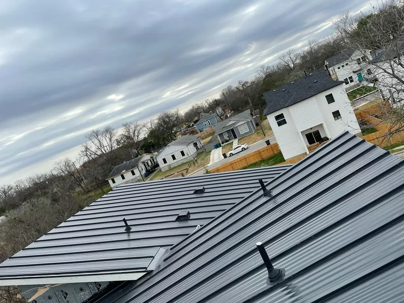 Standing seam metal roof panels with vents for Skylight Repair in Dennis